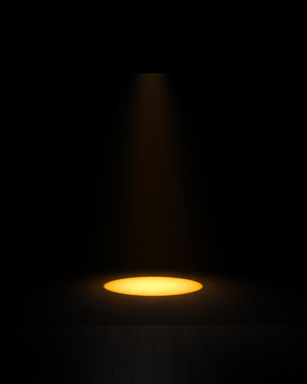 An empty stage lit by a single warm spotlight